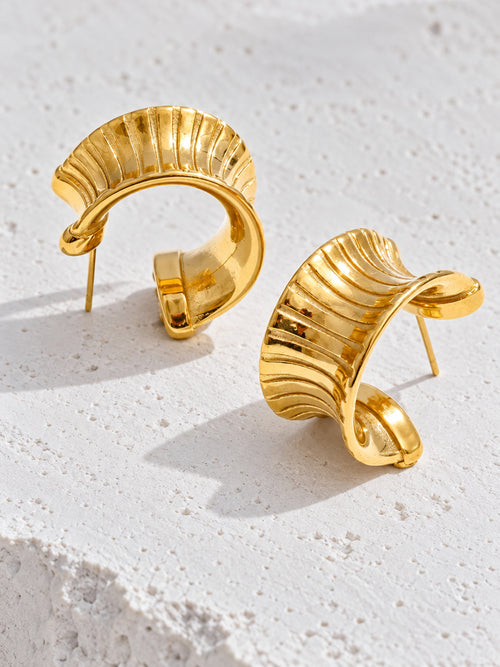 Cleo Huggie Earrings — neutral editorial product view