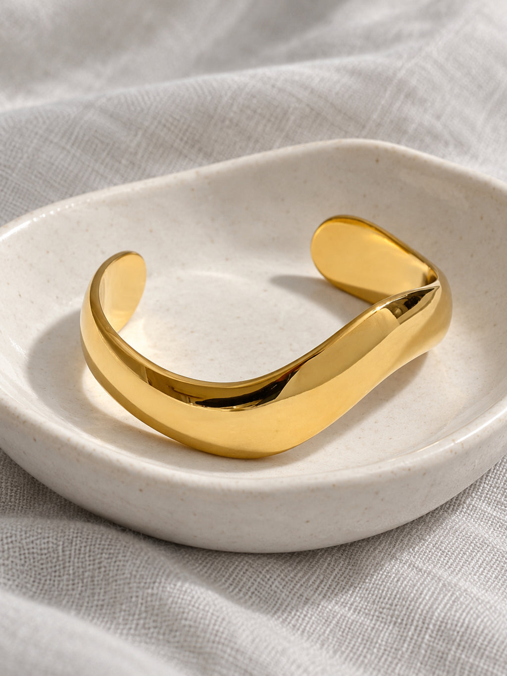 Sweep Sculptural Cuff — editorial still life